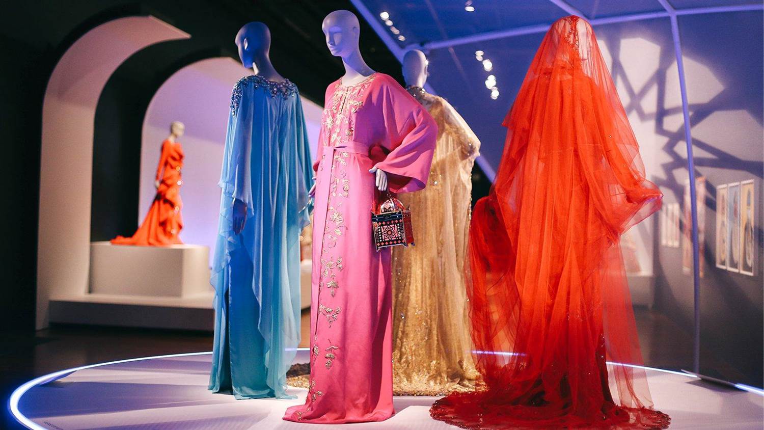 a selection of gowns on display at the Contemporary Muslim Fashions exhibit
